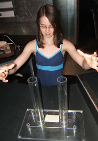 A visitor at the Bradbury Science Museum explores properties of "liquid metal," which has been used in golf clubs and other sporting equipment.