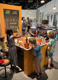 Build a Human Habitat on Mars - group of children building at exhibit