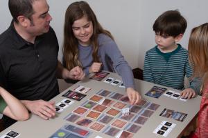Family playing Explore Mars! A Rover Game board game