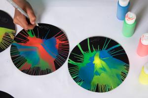 Nebula Spin Art activity black circles with paint