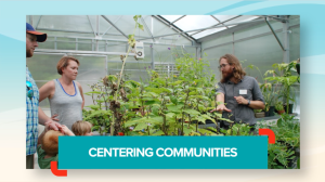 Museum educator talking with people in a greenhouse with plants