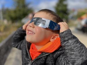 2023 Annular Eclipse_Child Viewing Outside The Bell Museum StPaul MN.jpg