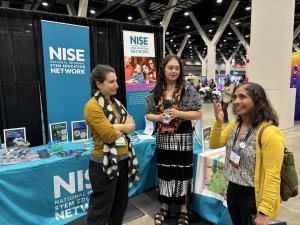 ASTC 2024 Chicago NISE Network booth with conference attendees