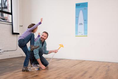 Family enjoying Stomp Rocket activity