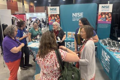 ASTC 2026 conference booth attended by museum educators
