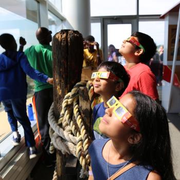 Young learners looking at the solar eclipse 
