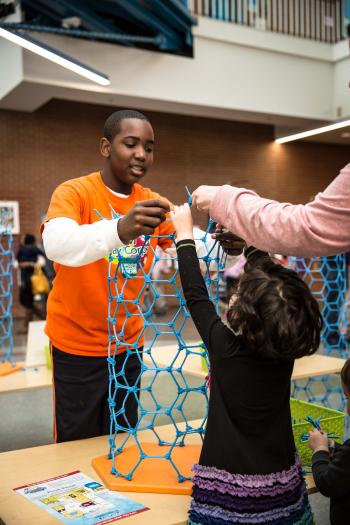 Learners and educator building a carbon nanotube