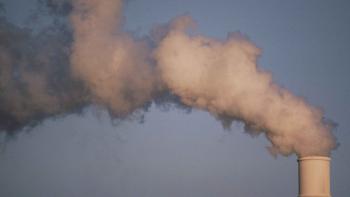Air pollution cloud of smoke emissions from chimney stack