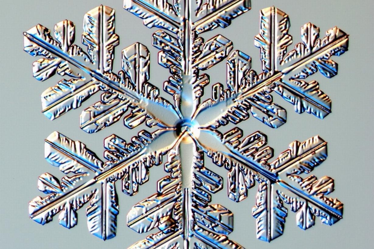 Close up photo of a snowflake crystal under a microscope