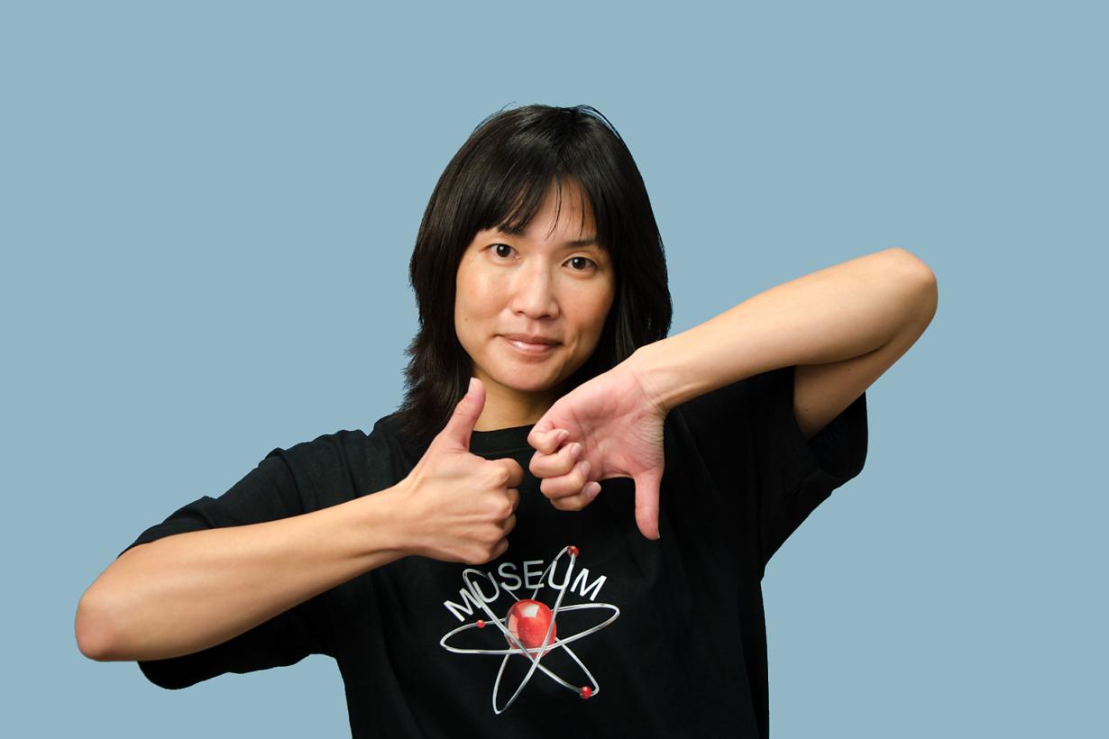 educator in black shirt posing with a thumb up and a thumb down