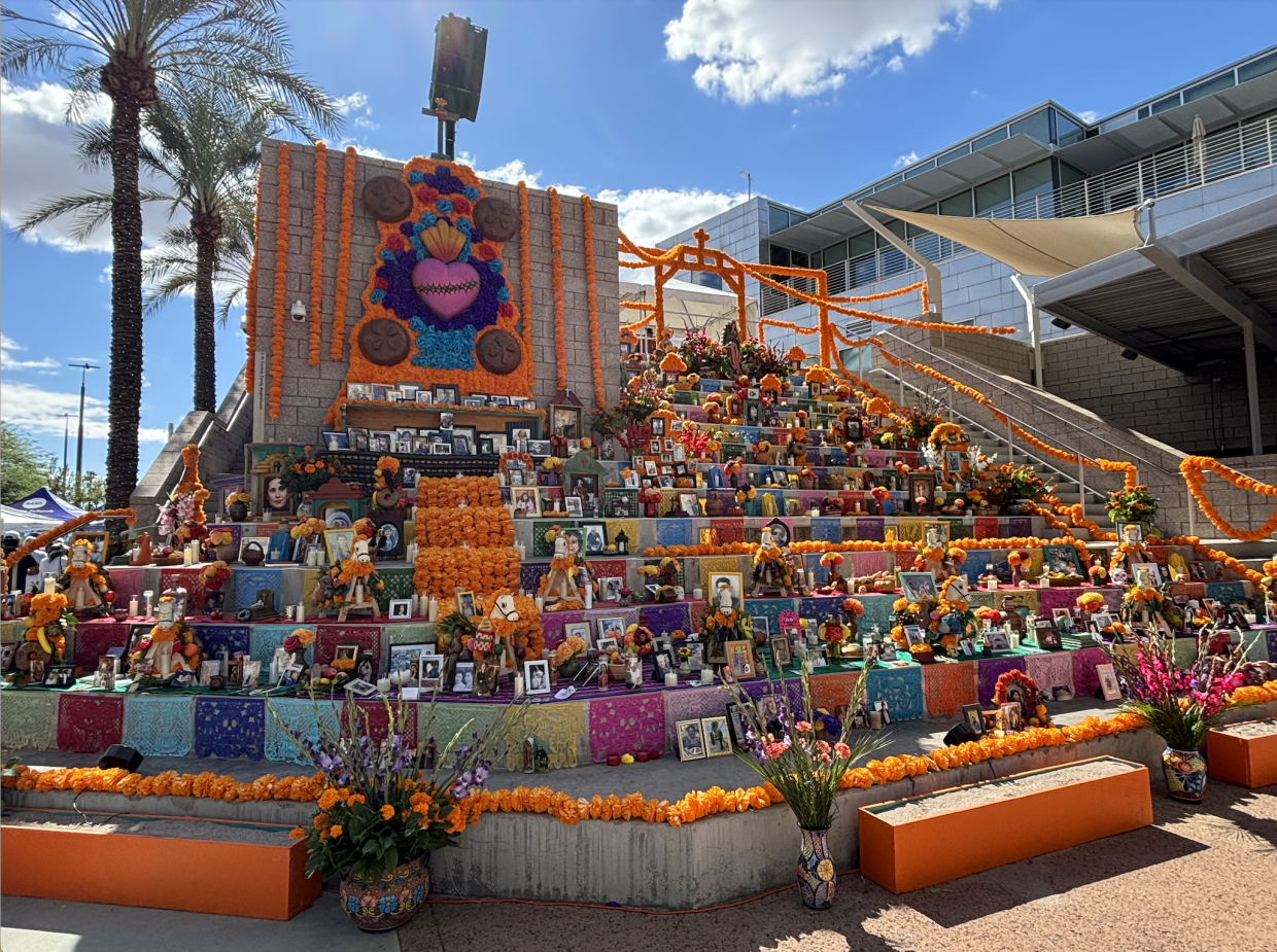 A large colorful display of offerings to the dead for the Dia de Los Muertos 2024 event in Mesa AZ
