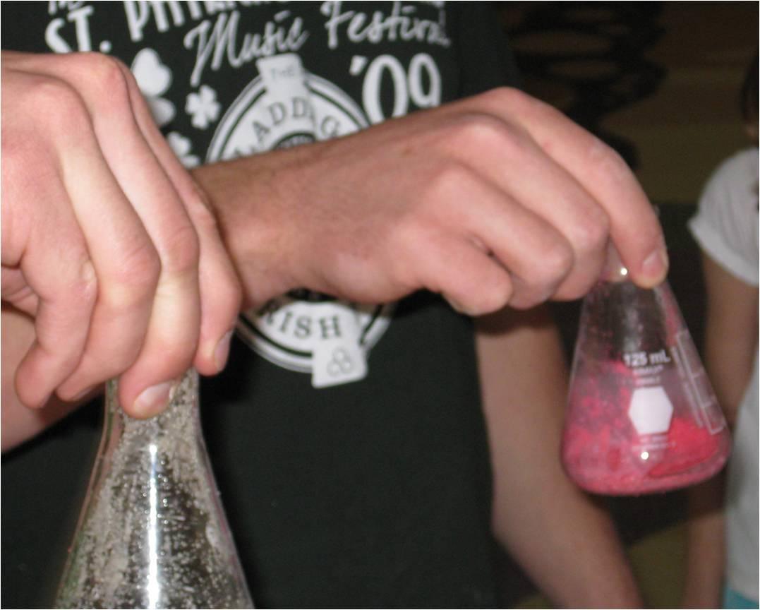 Mixing up magic sand and water in a flask