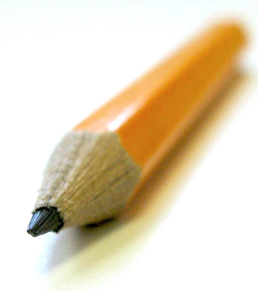 zoomed in view of a sharpened pencil focusing on the graphite pencil tip