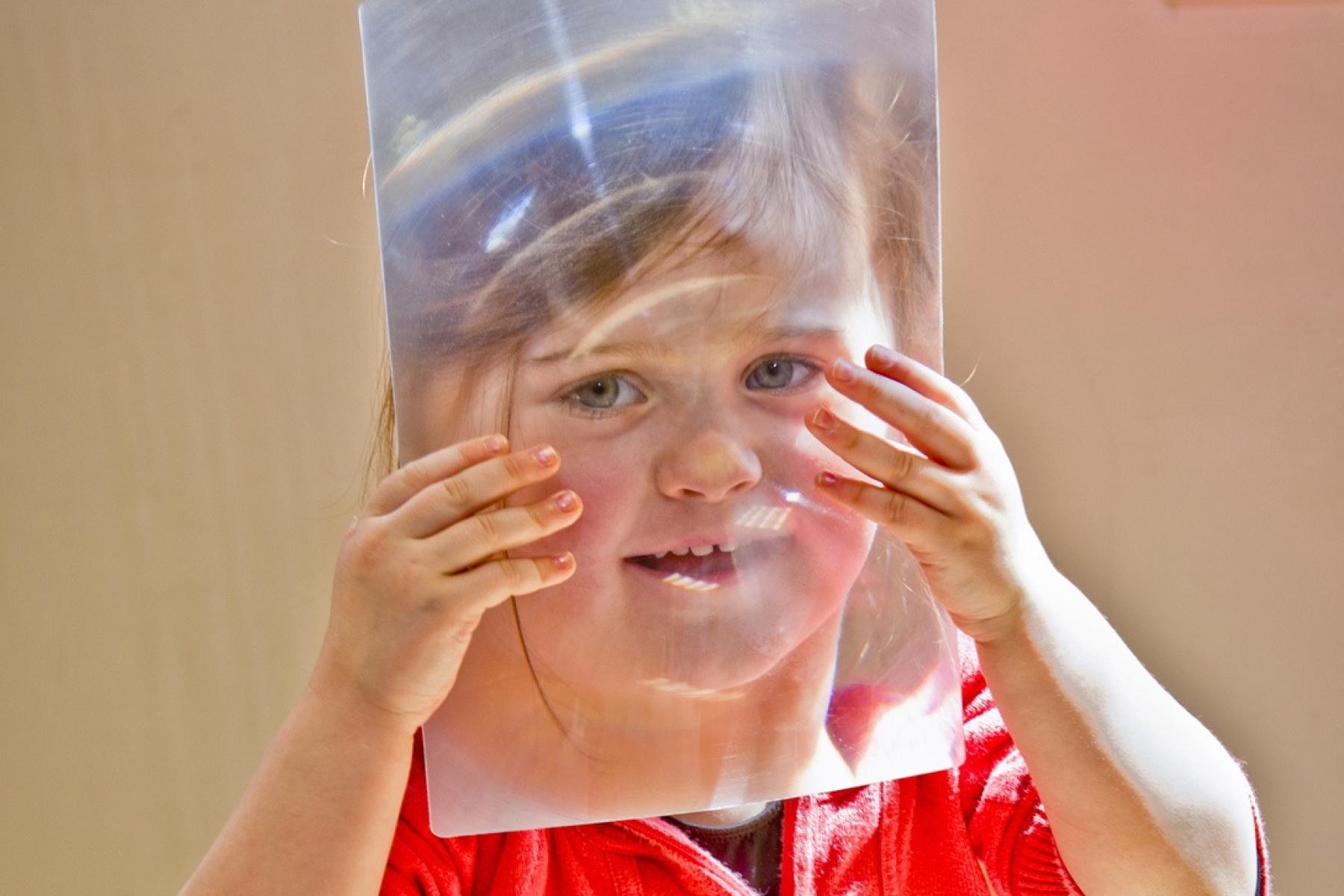 A young person does a thin film activity related to the story "Horton Senses Something Small"