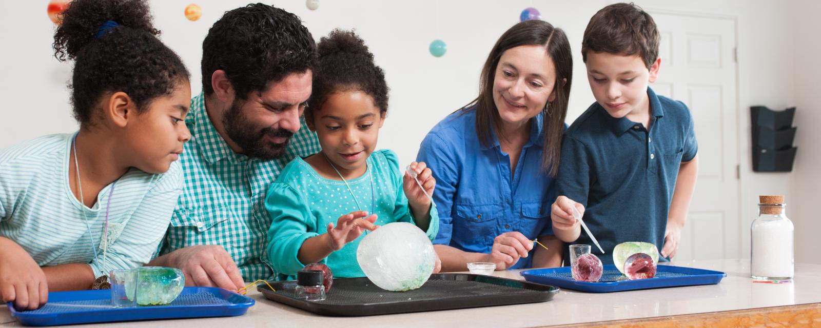 family looking at icy orb activity