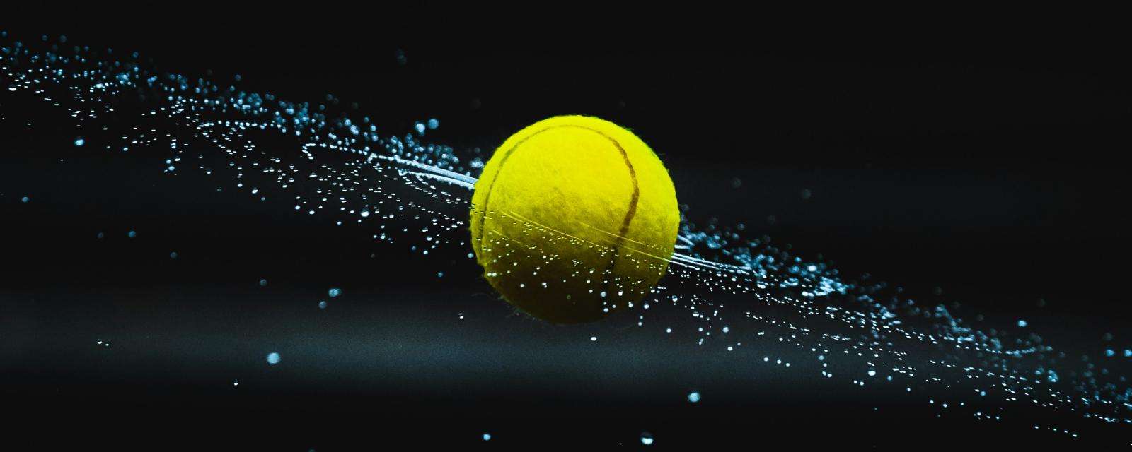 Tennis ball with dots showing rotational spin 