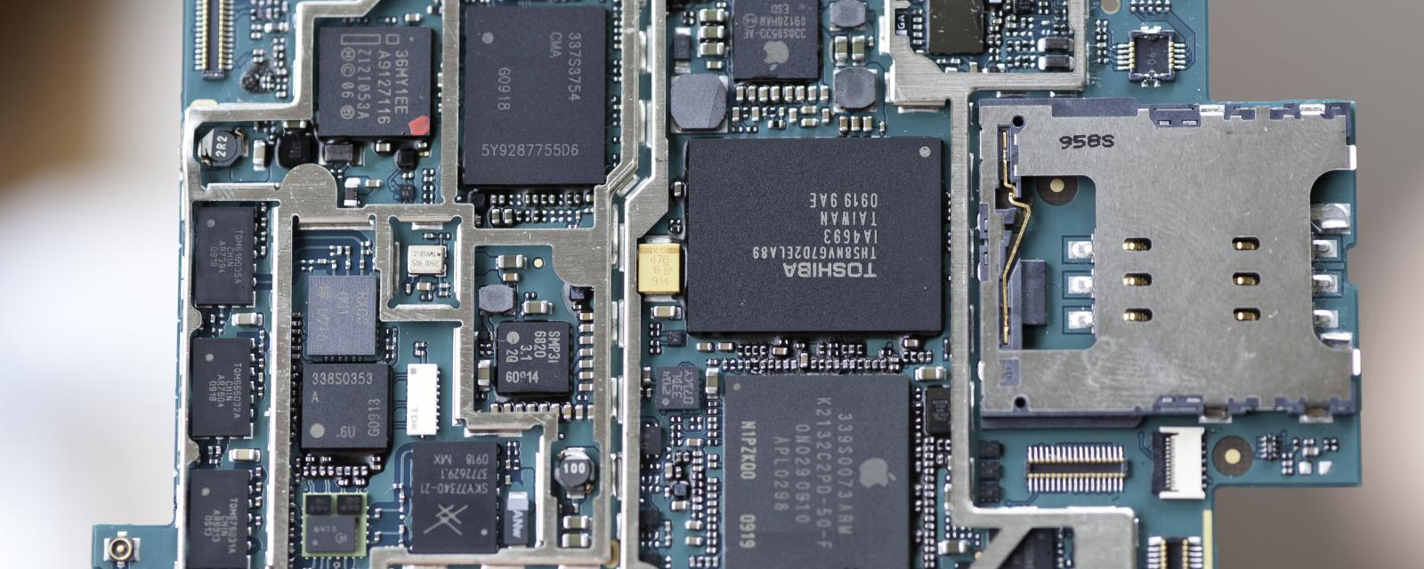 Photograph of an Apple iPhone motherboard.