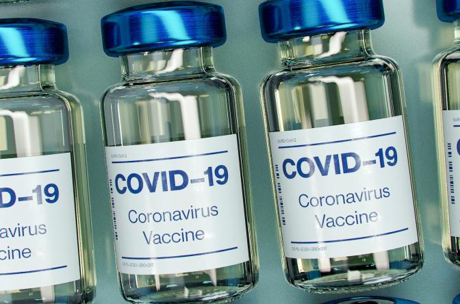 COVID vaccine image of glass vials labeled COVID-19 Coronavirus Vaccine