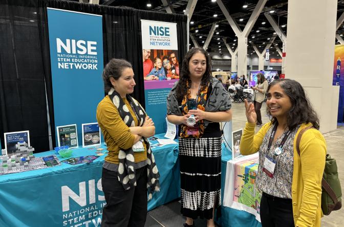 ASTC 2024 Chicago NISE Network booth with conference attendees